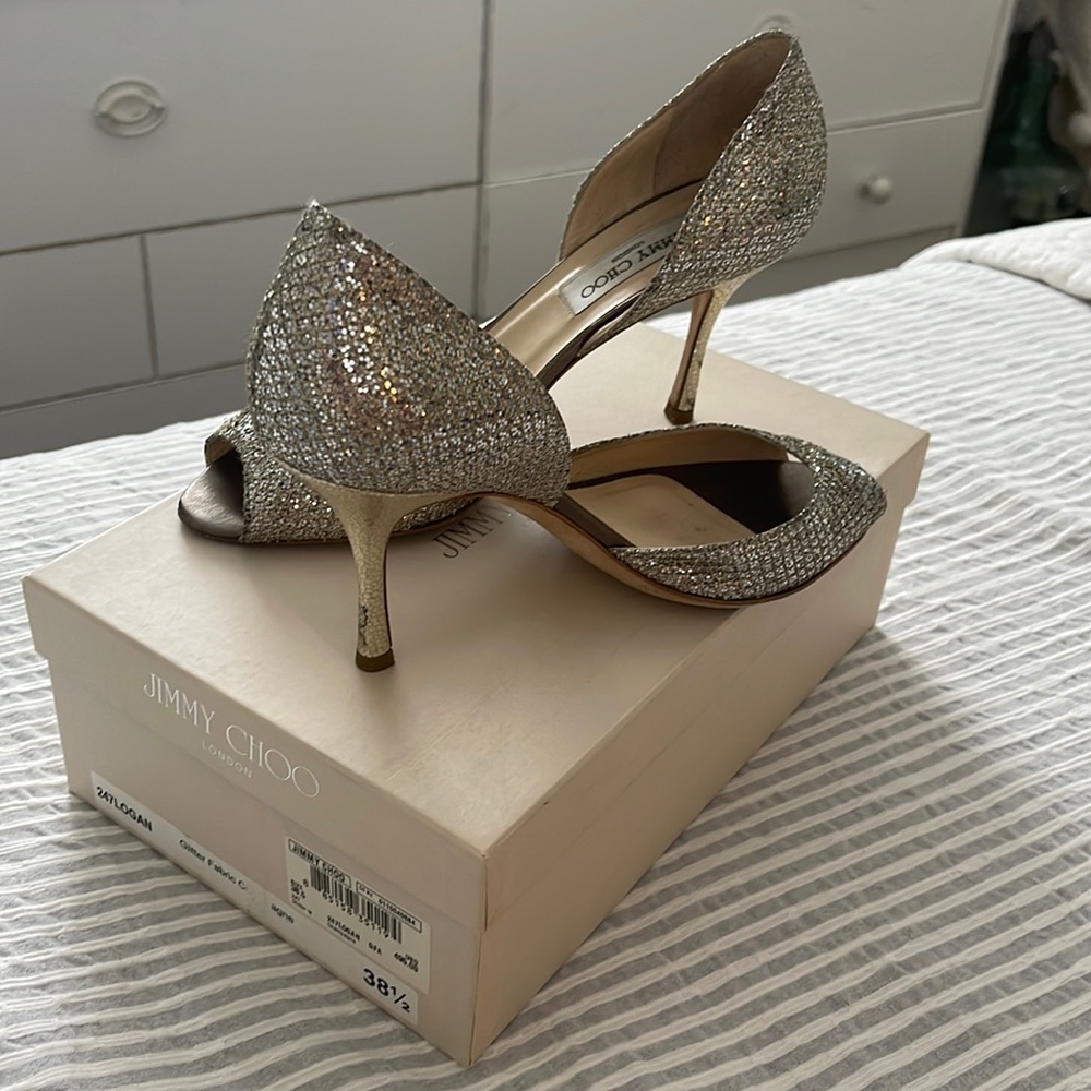 Jimmy Choo Logan. 38.5 . Lots of wear and tear. Champagne color.